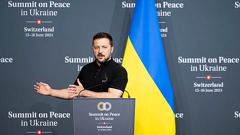 Ukraine's President Volodymyr Zelensky gestures as he addresses the closing press conference of the Summit on peace in Ukraine, at the luxury Burgenstock resort, near Lucerne, on June 16, 2024.