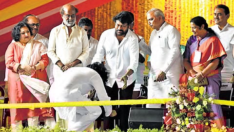 Jana Sena chief Pawan Kalyan takes the blessings of his brother Chiranjeevi after being sworn in as Deputy Chief Minister at Kesarapalli near Vijayawada on Wednesday