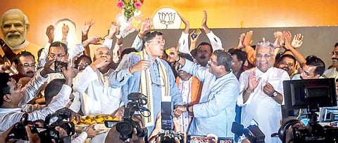 Jubilant BJP leaders Dharmendra Pradhan, Baijayant Panda & Union minister Bhupendra Yadav celebrate BJP victory with sweets, in Bhubaneswar on Tuesday 