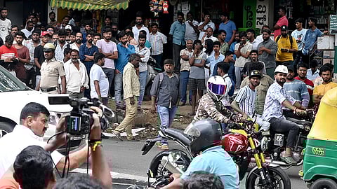 Crowd near Kamamkshipalya police station after the news of the arrest of actor Darshan in an alleged murder case and will be brought to this station, in Bengaluru on Tuesday.