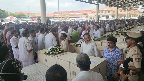 Officials in front of the mortal remains of Vijayakumar Prasanna (Photo | Special arrangement)
