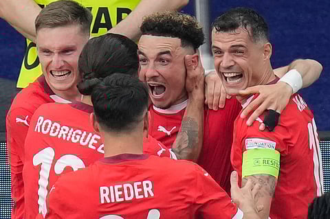 Switzerland's Ruben Vargas, center, celebrates with teammates after scoring his side's second goal during a round of sixteen match between Switzerland and Italy at the Euro 2024
