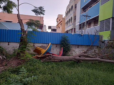 A huge tree trunk along with children's slide lying at the premises of Anna Nagar Science Park in Tiruchy on Sunday.
