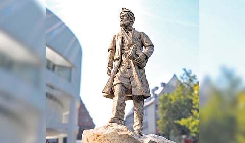 A statue of Persian poet Abul-Qâsem Ferdowsi Tusi .