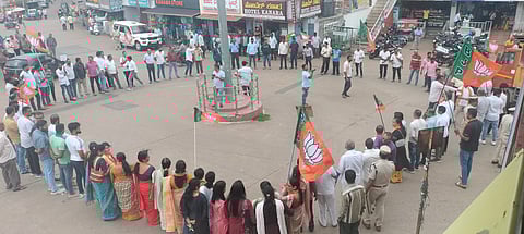 BJP protestors marching to the main town circles and forming a human chain