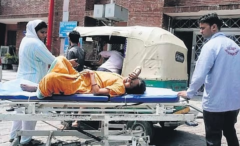 Woman being brought to a government hospital 