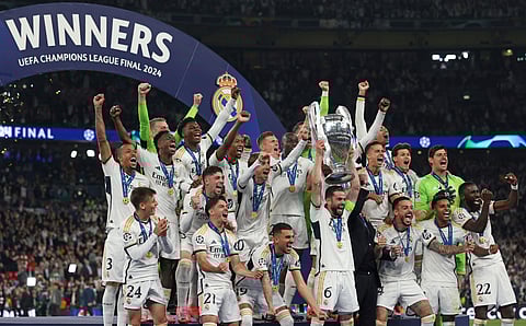 Real Madrid's Spanish defender Nacho Fernandez lifts the trophy to celebrate their victory at the end of the UEFA Champions League final football match between Borussia Dortmund and Real Madrid on June 1, 2024.