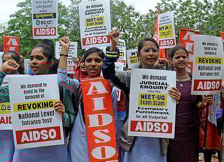 Members of AIDSO  demanding Judicial enquiry into the NEET -UG exam scam during their protest at Freedom park in Bengaluru.