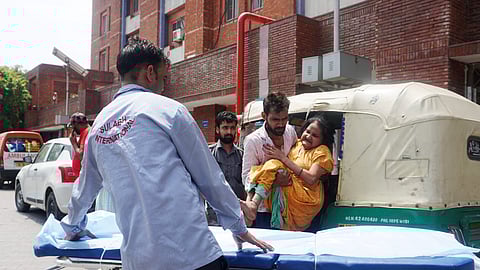 A woman suffering from a heat-related illness being brought to LNJP Hospital for treatment, as the national capital witnesses hot weather conditions, in New Delhi, Thursday, June 20, 2024.