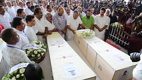 CM Pinarayi Vijayan lays a wreath on the coffin carrying the mortal remains of a Kuwait fire accident victim.