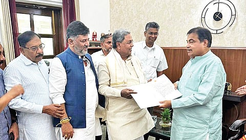 CM Siddaramaiah submits a list of the state’s demands to Union Surface Transport and Highways Minister Nitin Gadkari in New Delhi on Friday. DyCM DK Shivakumar, PWD Minister Satish Jarkiholi and Home Minister Dr G Parameshwara look on.