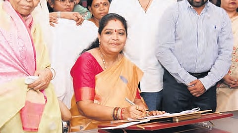 Women, Child and Tribal Welfare Minister Gummadi Sandhya Rani making her first signature on appointing ANMs in residential schools