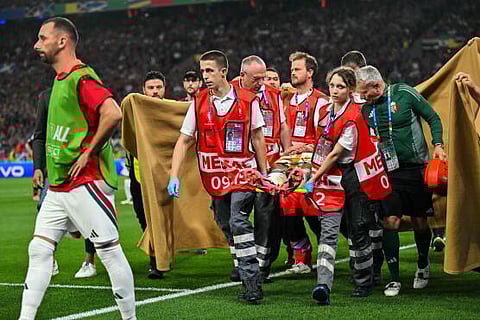 Hungary's forward Barnabas Varga is evacuated on a stretcher after getting injured during the UEFA Euro 2024 Group A football match between Scotland and Hungary at the Stuttgart Arena, on June 23, 2024.