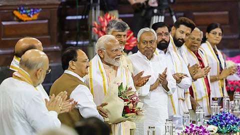BJP President Jagat Prakash Nadda welcomes Prime Minister Narendra Modi during the NDA parliamentary party meeting at Samvidhan Sadan.