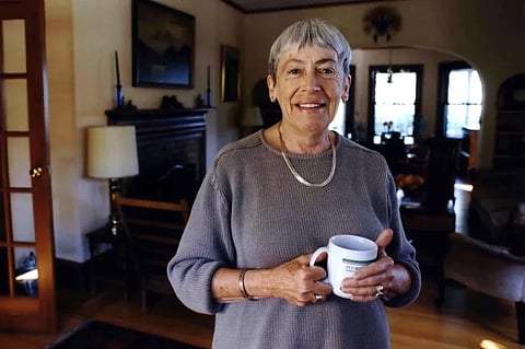 FILE - Ursula K. Le Guin, an American author of novels and children’s books, poses for a photo at home on Sept. 9, 2001, in Portland, Ore. 