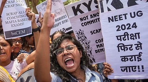 Members of various student organisations stage a protest against the alleged irregularities in the NEET-UG 2024 entrance exam result in New Delhi on Monday.