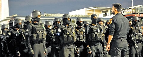 Security forces try to contain the situation during the mock drill at KIA on Monday