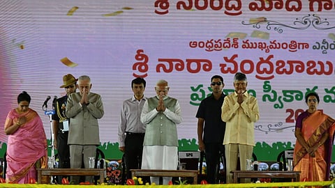 Prime Minister Narendra Modi with TDP supremo and Andhra Pradesh Chief Minister-designate N Chandrababu Naidu at the latters swearing-in ceremony, in Amaravati.