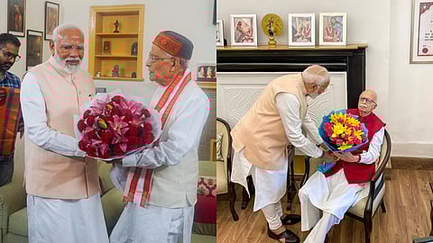 BJP leader Narendra Modi meets senior party leader L.K. Advani and Murli Manohar Joshi after he was elected as the leader of the NDA Parliamentary Party.