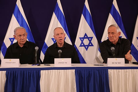 (From left) Israeli Prime Minister Benjamin Netanyahu, Defense Minister Yoav Gallant and Cabinet Minister Benny Gantz speak during a news conference in the Kirya military base in Tel Aviv, Israel on Oct. 28, 2023.