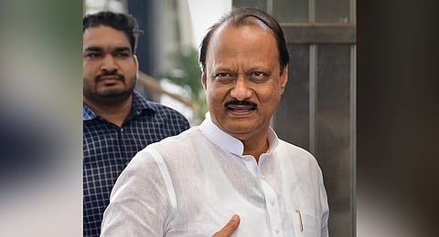 Maharashtra Chief Minister Eknath Shinde (R) and Deputy Chief Minister Devendra Fadnavis (C) pay tribute to RSS founder Keshav Baliram Hedgewar at the RSS Smriti Mandir in Nagpur on Aug 31, 2024. 