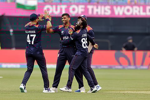 United States' Saurabh Nethralvakar, second left, celebrates with teammates after the dismissal of India's Virat Kohli during the ICC Men's T20 World Cup cricket match between United States and India on Wednesday, June 12, 2024.