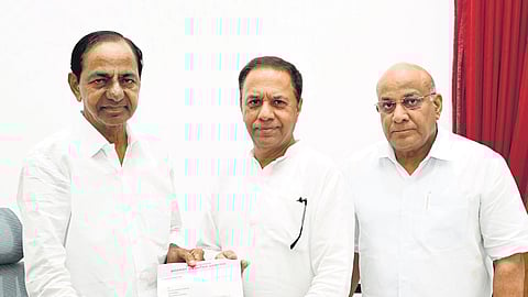 Former CM K Chandrasekhar Rao hands over a letter to KR Suresh Reddy, appointing him as the BRS Parliamentary Party leader and its floor leader in Rajya Sabha