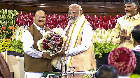 Senior BJP leader Narendra Modi being felicitated by BJP National President J.P. Nadda during the NDA parliamentary party meeting at Samvidhan Sadan, in New Delhi, Friday, June 7, 2024.