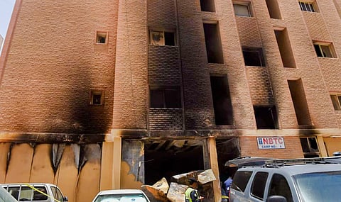 The building where a fire broke out in Mangaf on June 12.