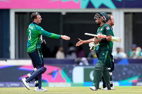 Ireland's Lorcan Tucker, left, congratulates Pakistan's captain Babar Azam after Pakistan won the ICC Men's T20 World Cup cricket match against Ireland