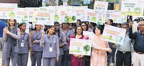 Teachers and students of Government Higher Secondary School for Girls, Ernakulam, carrying placards highlighting the importance of planting trees as part of the World Environment Day observance on Wednesday