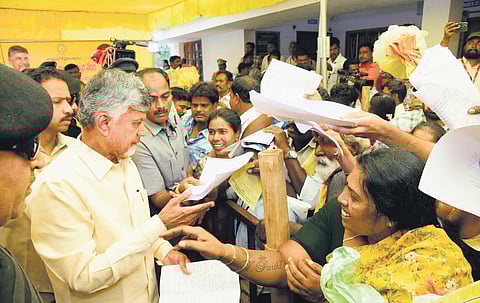 Chief Minister Nara Chandrababu Naidu takes representations from people during his visit to home constituency Kuppam.