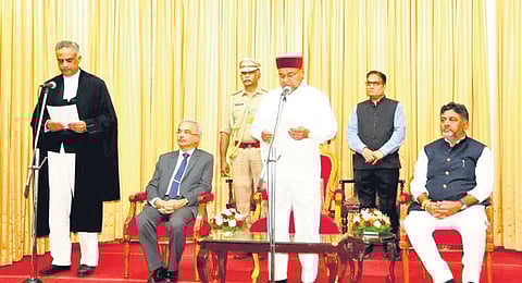 Governor Thaawarchand Gehlot administers the oath of office to Valluri Kameswar Rao as the Judge of Karnataka High Court at Raj Bhavan in Bengaluru on Saturday 