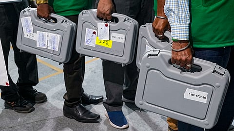 Polling officials at a counting centre on the day of counting of votes for Lok Sabha elections, in Mumbai.