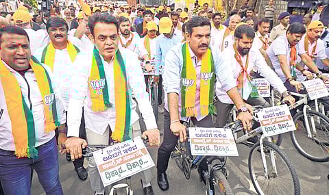 BJP state president BY Vijayendra, MLA Dr CN Ashwath Narayan and MLC CT Ravi take part in a cycle rally in protest against the rise in fuel prices, from the party office to Vidhana Soudha in Bengaluru on Thursday