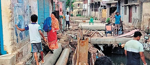 Sources said residents of Sutahat including school students are forced to cross the construction site precariously by walking on iron pipes. 