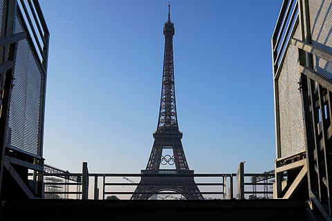 The Paris Olympics organizers mounted the rings on the Eiffel Tower on Friday as the French capital marks 50 days until the start of the Summer Games. 