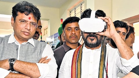 Chief Minister A Revanth Reddy wears a VR headset at the Mallepally ITI centre in Hyderabad on Tuesday where he laid the foundation stone for an ATC  