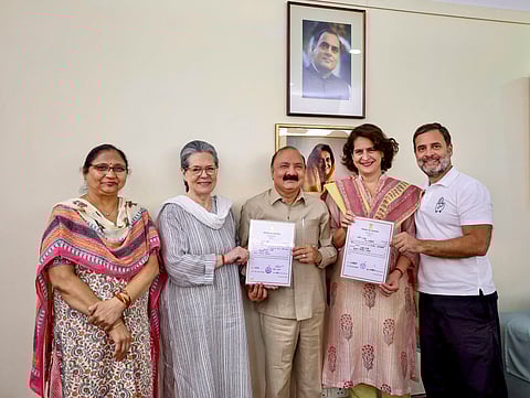Newly elected Congress MPs, from Rae Bareli constituency Rahul Gandhi and from Amethi constituency Kishori Lal Sharma show their victory certificates along with party leaders Sonia Gandhi and Priyanka Gandhi Vadra.
