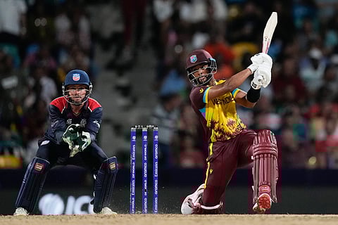 West Indies' Shai Hope hits a six during the men's T20 World Cup cricket match between the USA and the West Indies at Kensington Oval, Bridgetown, Barbados, Friday, June 21, 2024.