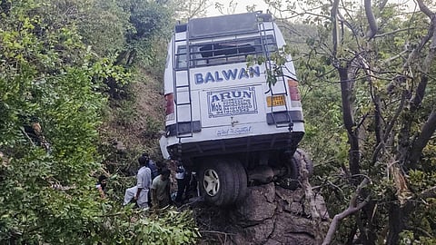 Reasi: The damaged bus after it plunged into a gorge following an alleged attack by suspected terrorists, in Reasi district of Jammu and Kashmir