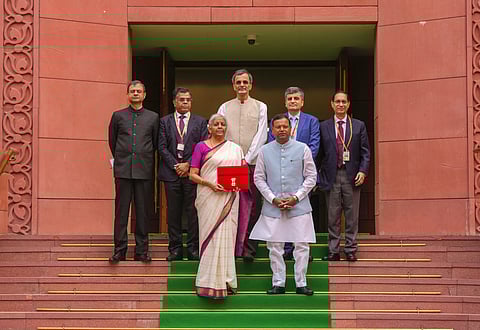 Union Finance Minister Nirmala Sitharaman with a red pouch carrying the Budget documents at the Parliament to present the Union Budget 2024-25, in New Delhi, Tuesday, July 23, 2024. 