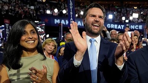 Republican vice presidential candidate Sen. JD Vance, R-Ohio, and his wife Usha Chilukuri Vance arrive on the floor during the first day of the 2024 Republican National Convention at the Fiserv Forum.