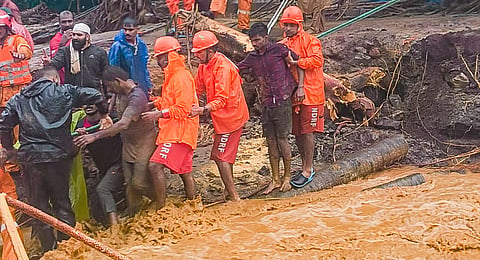 National Disaster Response Force (NDRF) personnel conduct rescue operation after huge landslides in the hilly areas near Meppadi, in Wayanad district, Kerala, Tuesday, July 30, 2024.