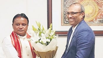 CM Mohan Charan Majhi being greeted by Hindalco MD Satish Pai in Bhubaneswar on Thursday