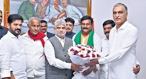 BRS MLA T Harish Rao presents a bouquet of flowers to Speaker Gaddam Prasad in Hyderabad on Tuesday