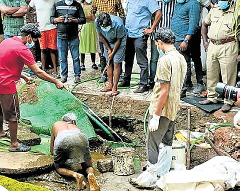 The septic tank at the house of Anil being opened, at Mannar in Mavelikkara.