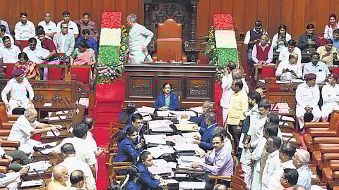 BJP and JDS members protest in the well of the Council against the Congress government over the ST Corporation issue, on Tuesday 
