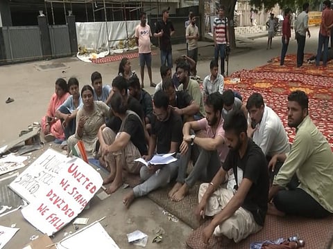 Students protest outside a coaching institute in Delhi's Rajinder Nagar on Wednesday.