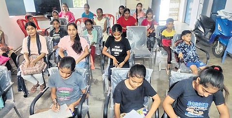 Mina Bisen is running a free English language coaching class at the Charegaon Gram Panchayat building
